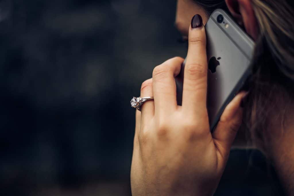 woman wearing wedding ring talking on the phone